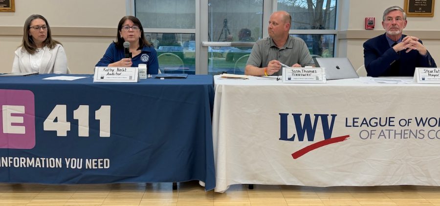 Athens Auditor Kathy Hecht speaks at a town hall about a proposed income tax increase as other city officials listen.
