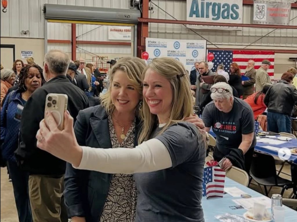 Secretary of state candidate Rep. Allison Russo poses for a selfie at a campaign event