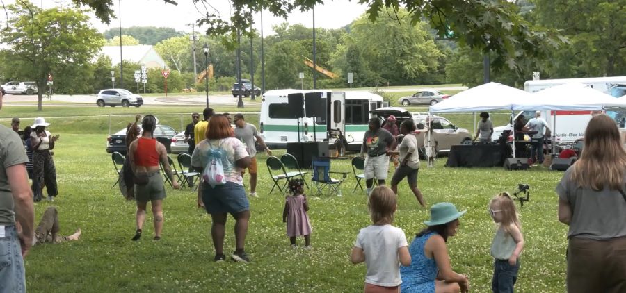 Community members dance together during Athens' Juneteenth celebration.