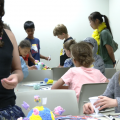 Campers Sophia and Piper play with their exoplanet model for the "Space Morphers" activity.