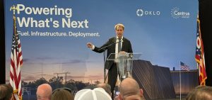 Oklo CEO Jacob DeWitte talks to a crowd gathered on the site of the former Portsmouth Gaseous Diffusion Plant in Pike County.