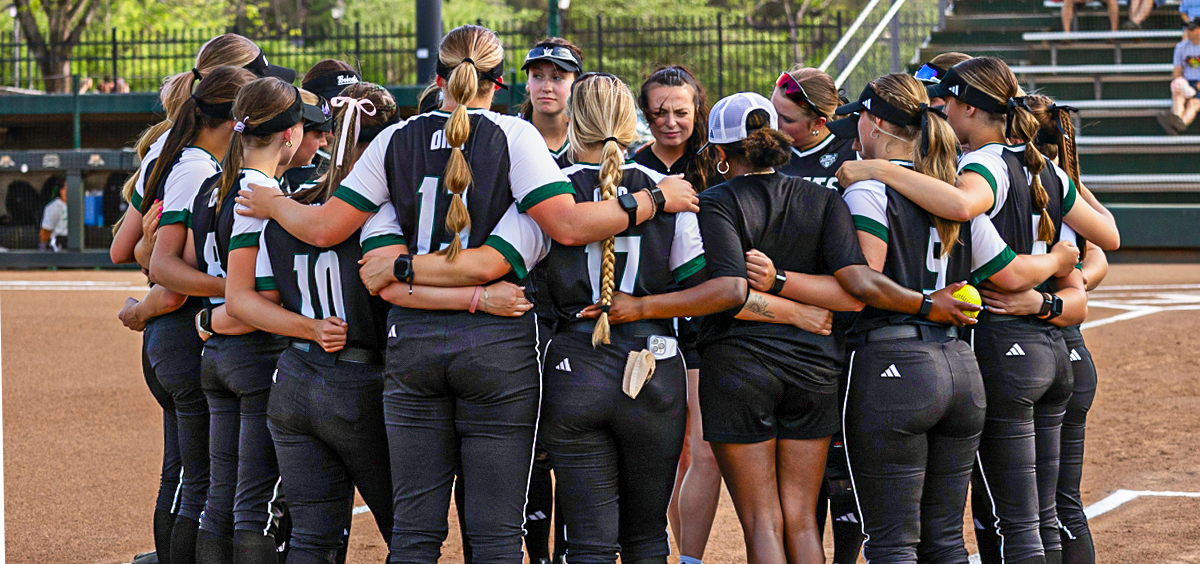 Ohio Softball team standing in a circle.