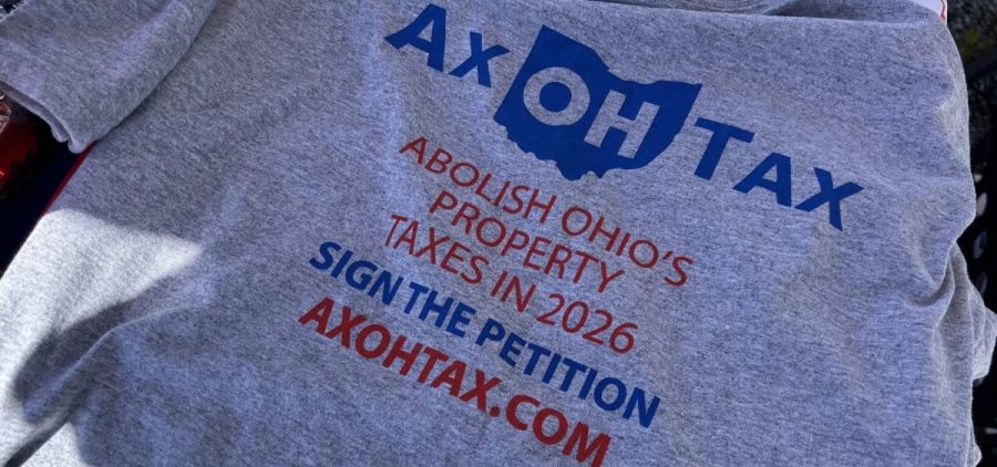 A gray tshirt reads "Ax OH Tax" to promote a constitutional amendment to abolish property tax in Ohio.