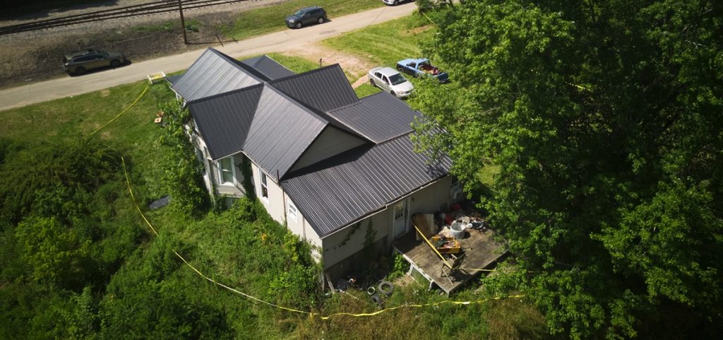 Police tape surrounds a home