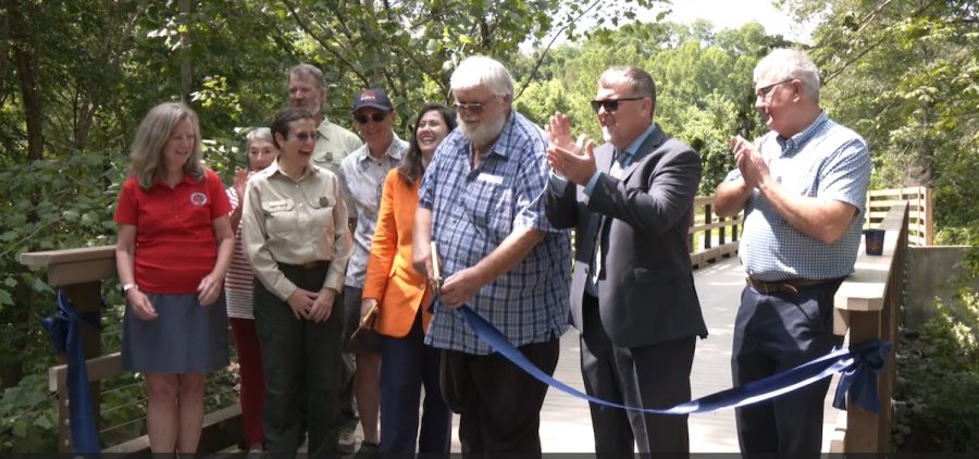 State and local officials attend a ribbon-cutting ceremony marking the completion of the 88-mile Baileys Trail System in southeast Ohio.