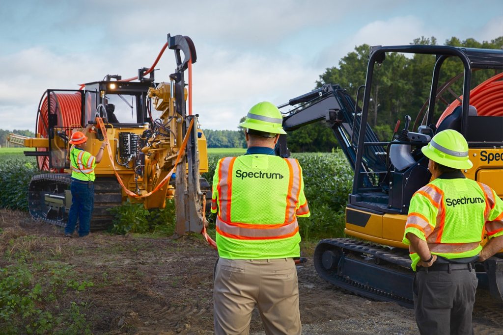 Spectrum workers oversee construction as the company works to expand broadband access in Ohio.