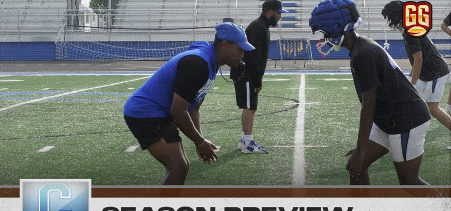 Head coach TJ Carper helps develop his team during a team practice.