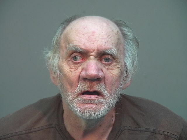 A mugshot of an older white man.
