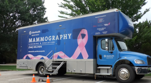 An imaging truck sits outside of the clinic for mammography