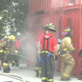 Campers practice hose advancement at Ohio Youth Fire Camp at Hocking College. [Jenna Bolton | WOUB Public Media]