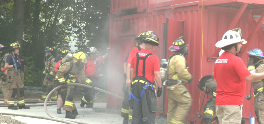 Campers practice hose advancement at Ohio Youth Fire Camp at Hocking College. [Jenna Bolton | WOUB Public Media]