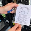 Suzanne Bachmeyer holds up instructions for a fentanyl test strip