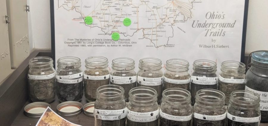 The temporary display at the Underground Railroad Museum displays 14 jars, each filled with the dirt from a lynching site in Ohio.
