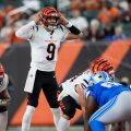 Cincinnati Bengals quarterback Joe Burrow (9) signals at the line of scrimmage against the Detroit Lions during the first half of a preseason NFL football game