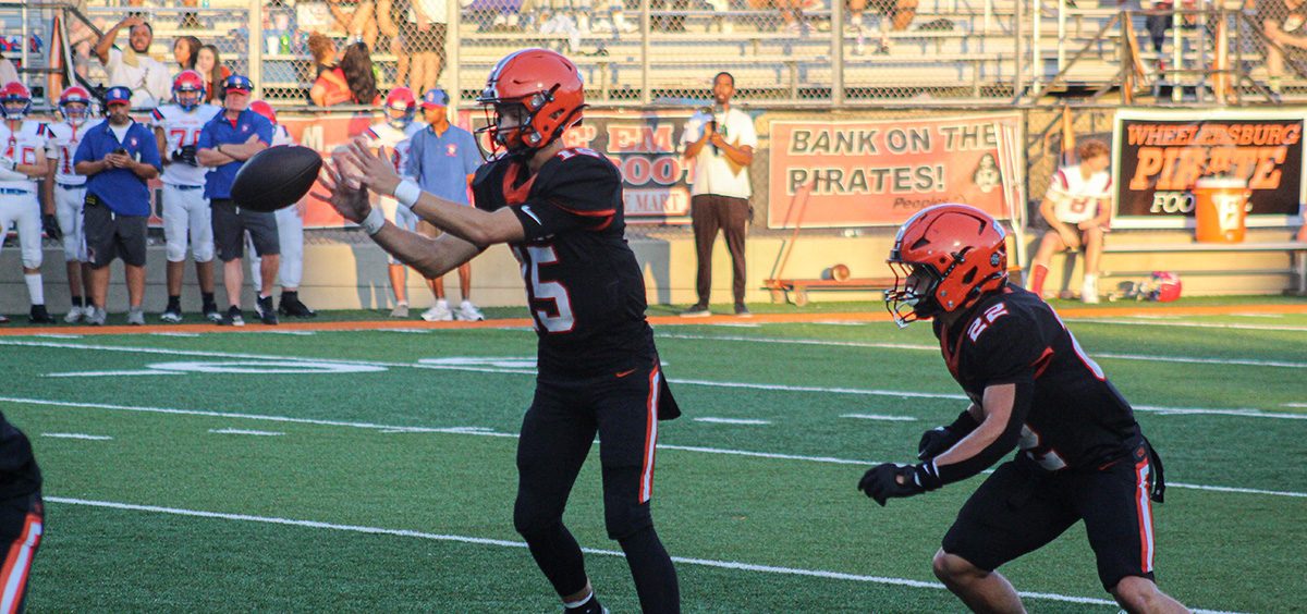 The Wheelersburg Pirates take the snap during their week one matchup against the Portsmouth Trojans.