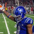 Cartae Ligon celebrating on the sideline during the week one matchup.