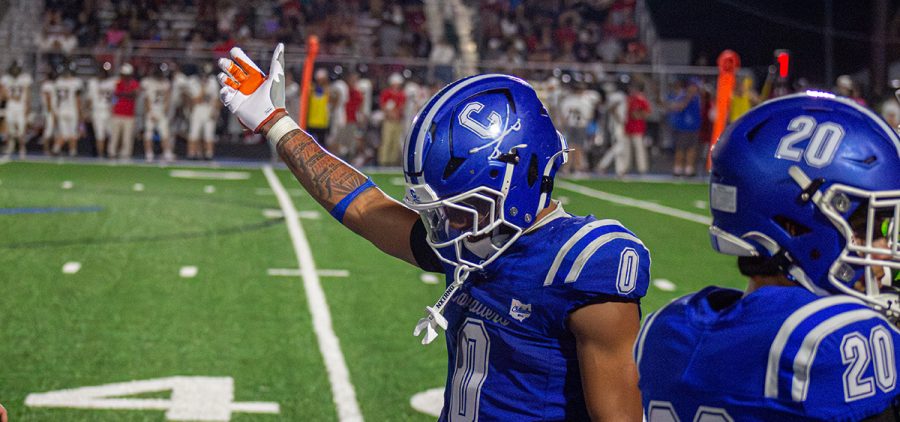 Cartae Ligon celebrating on the sideline during the week one matchup.