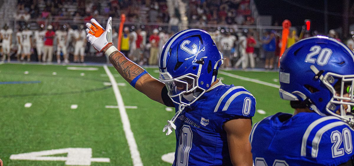 Cartae Ligon celebrating on the sideline during the week one matchup.