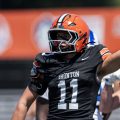 Ironton defensive player motioning that his team has possession after forcing a fumble against the Salem Rams of New Jersey.