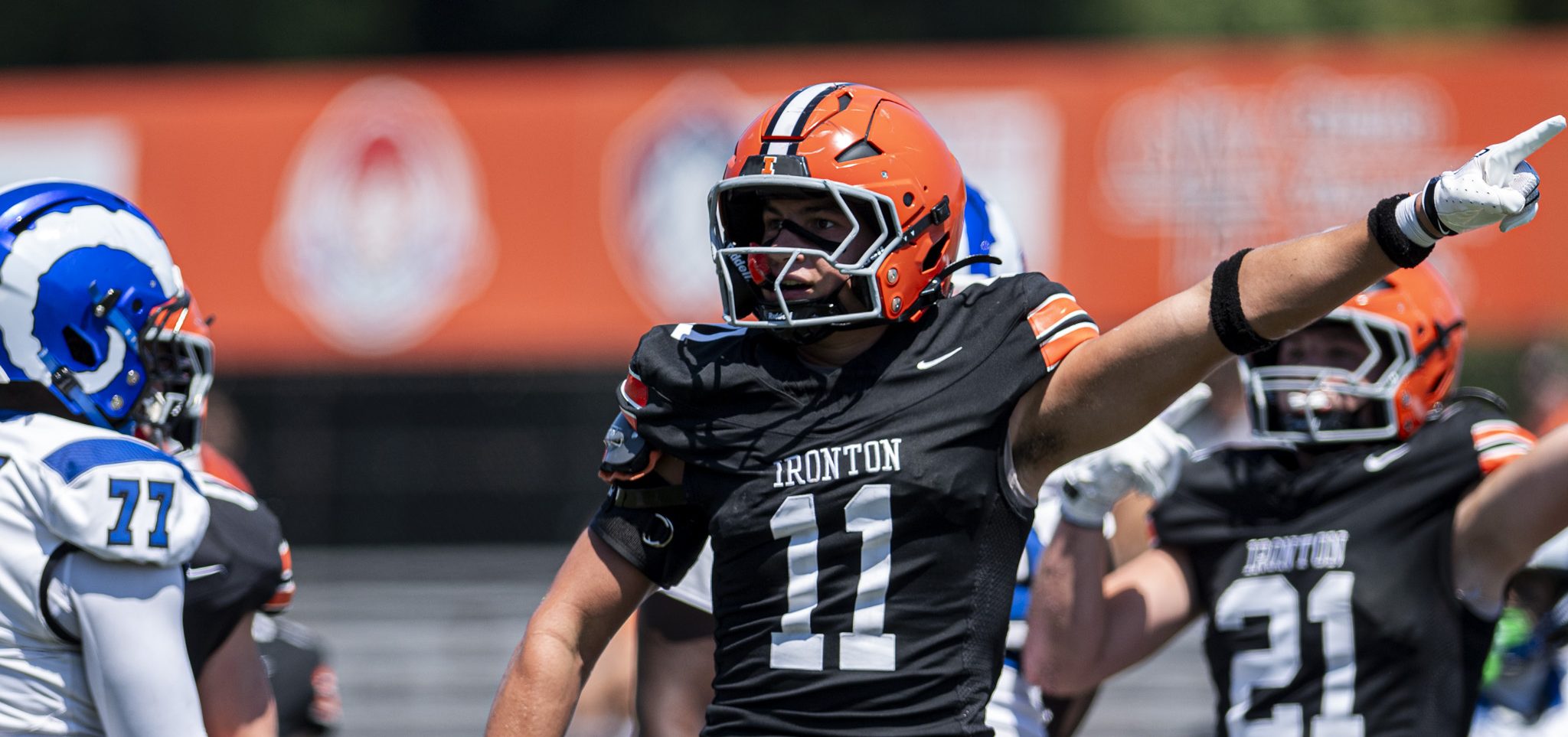 Ironton defensive player motioning that his team has possession after forcing a fumble against the Salem Rams of New Jersey.