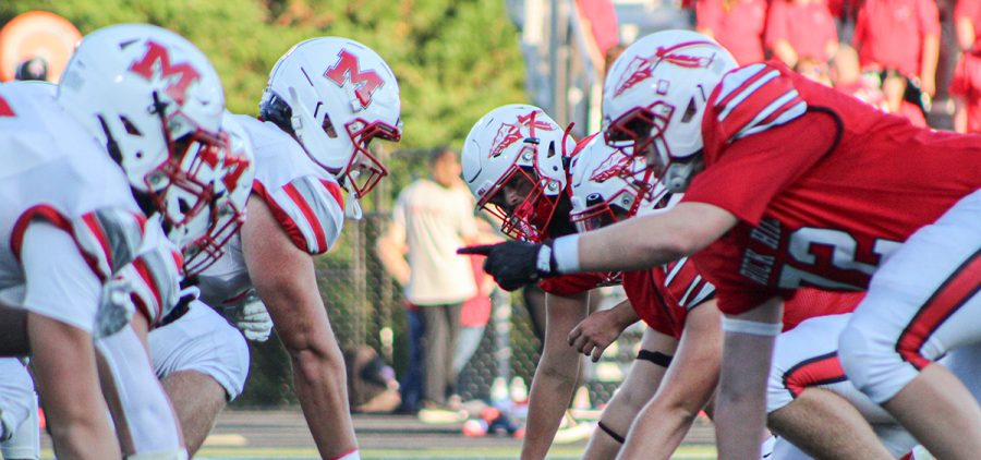 Minford and Rock Hill linemen line up for a play during their game.