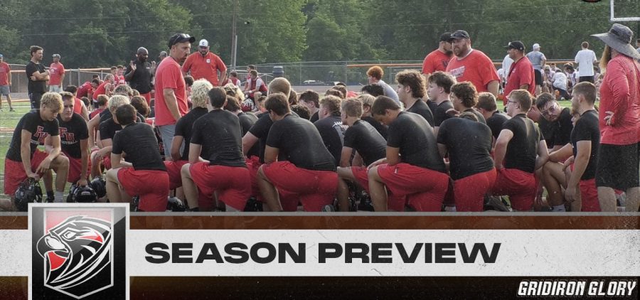 The Fairfield Union Falcons huddle around coach after a summer practice.