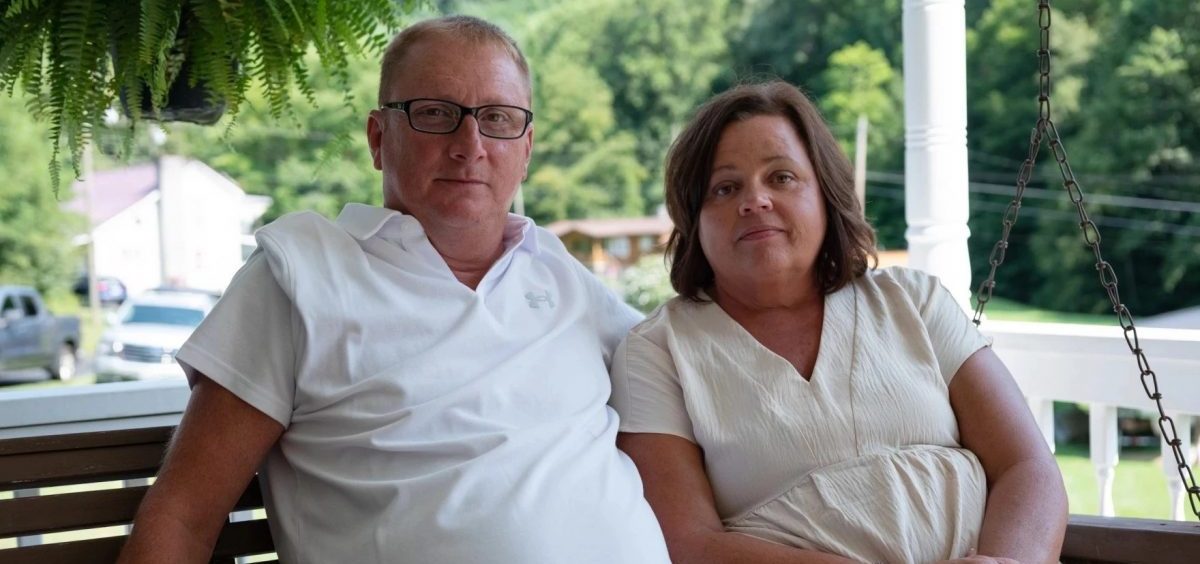 Tim Balthis looks healthy, sitting with his wife Fran Balthis on their porch in Pound, Va.