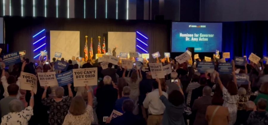 Candidate for governor Amy Acton takes the stage after being introduced with a video at the Ohio Democratic Party's state dinner