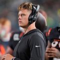 Cincinnati Bengals quarterback Joe Burrow watches action from the sidelines