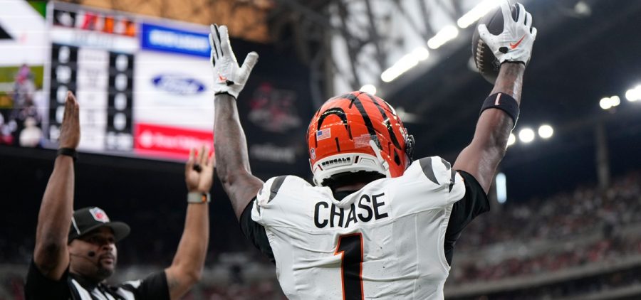 Cincinnati Bengals wide receiver Ja'marr Chase (1) celebrates after catching a pass for a touchdown from Joe Burrow.