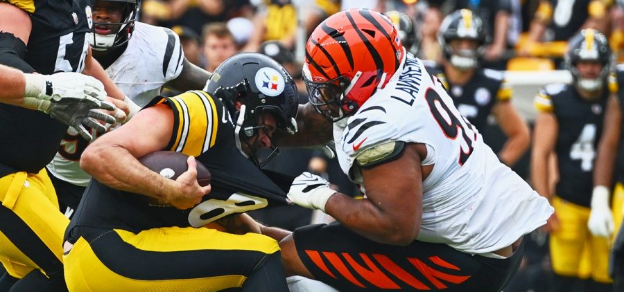 Cincinnati Bengals defensive tackle Dexter Lawrence II (97) grabs Pittsburgh Steelers quarterback Aaron Rodgers (8) by the jersey during the second half of an NFL football game