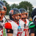 The Belpre Golden Eagles and Green Bobcats are meeting up for the coin toss before the game starts.