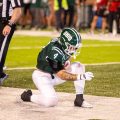 Victor Rosa kneeling after a game tying touchdown