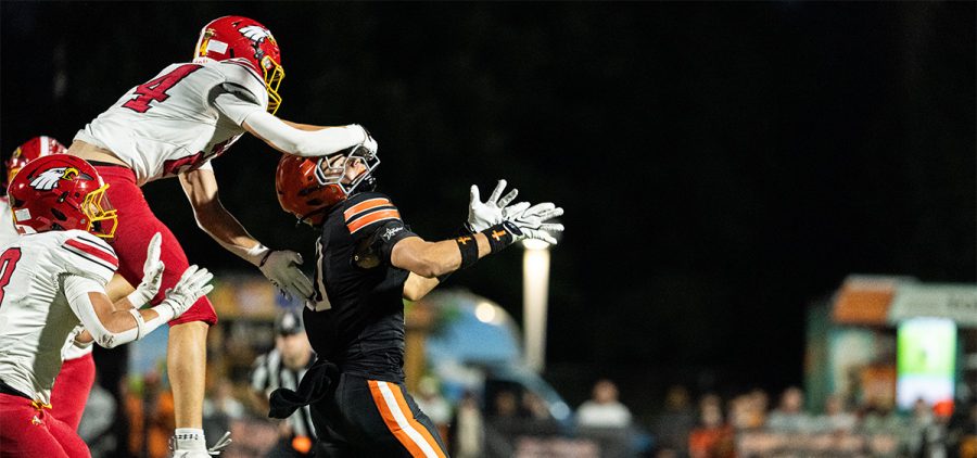 The Big Walnut defender breaks up a pass to the Ironton receiver, while grabbing a handful of face mask.