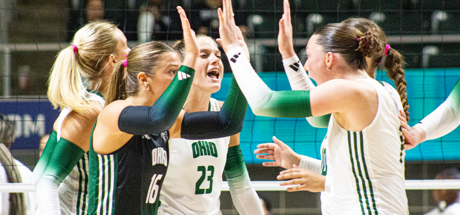 Ohio Volleyball team celebrates scoring a point in win against Morgan State