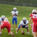 The Warren QB claps his hands to start the play against the Hillsboro Indians.