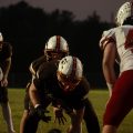 Minford and Eastern line up at the ball to snap it and run a play.