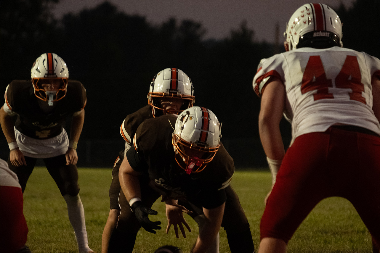Minford and Eastern line up at the ball to snap it and run a play.