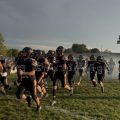 The Amanda-Clearcreek Aces are running out of the tunnel to prepare for the game.
