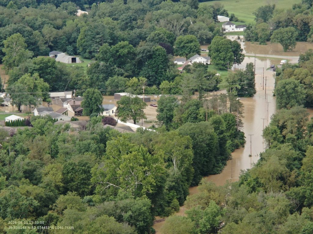 Floodwaters submerged buildings in communities like Roseville in August, following intense storms.