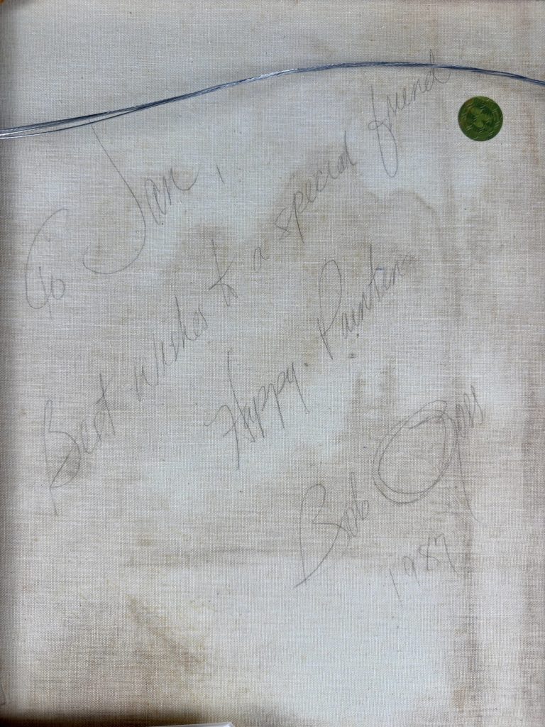 A handwritten inscription on the back of one of the paintings reads, "To Jan, Best Wishes to a special friend. Happy Painting. Bob Ross. 1987"
