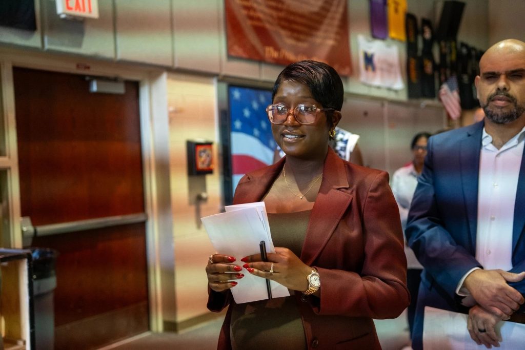 Faith Isaya attends a naturalization ceremony where she will become a U.S. Citizen.
