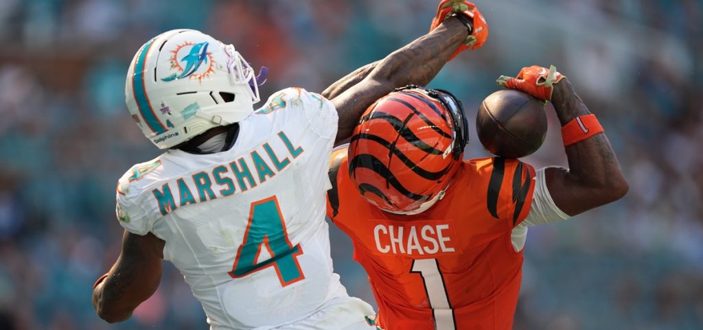 Cincinnati Bengals wide receiver Ja'marr Chase (1) catches a pass for a touchdown as Miami Dolphins cornerback Jason Marshall Jr. (4) defends