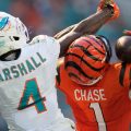 Cincinnati Bengals wide receiver Ja'marr Chase (1) catches a pass for a touchdown as Miami Dolphins cornerback Jason Marshall Jr. (4) defends