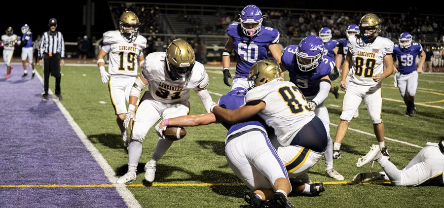 Logan receiver reaches for the end zone to cut the Lancaster lead late in the game.