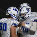 A Sciotoville East player is celebrating with their teammate