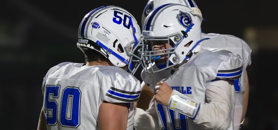 A Sciotoville East player is celebrating with their teammate