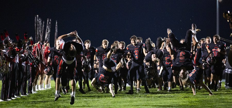 The Fairfield Union Falcons run out before their win against Hamilton Township.