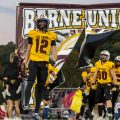 Berne Union players run out on the field to take on Fisher Catholic in MSL play.