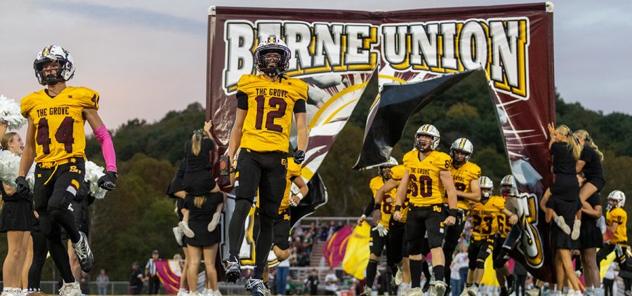 Berne Union players run out on the field to take on Fisher Catholic in MSL play.